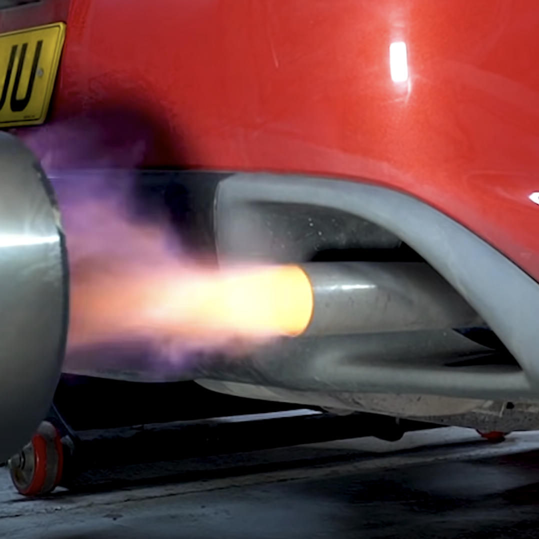 A Mazda RX-8 exhaust spitting flames